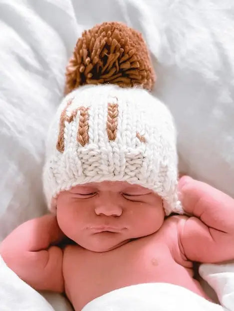 gender-neutral pom pom baby hat